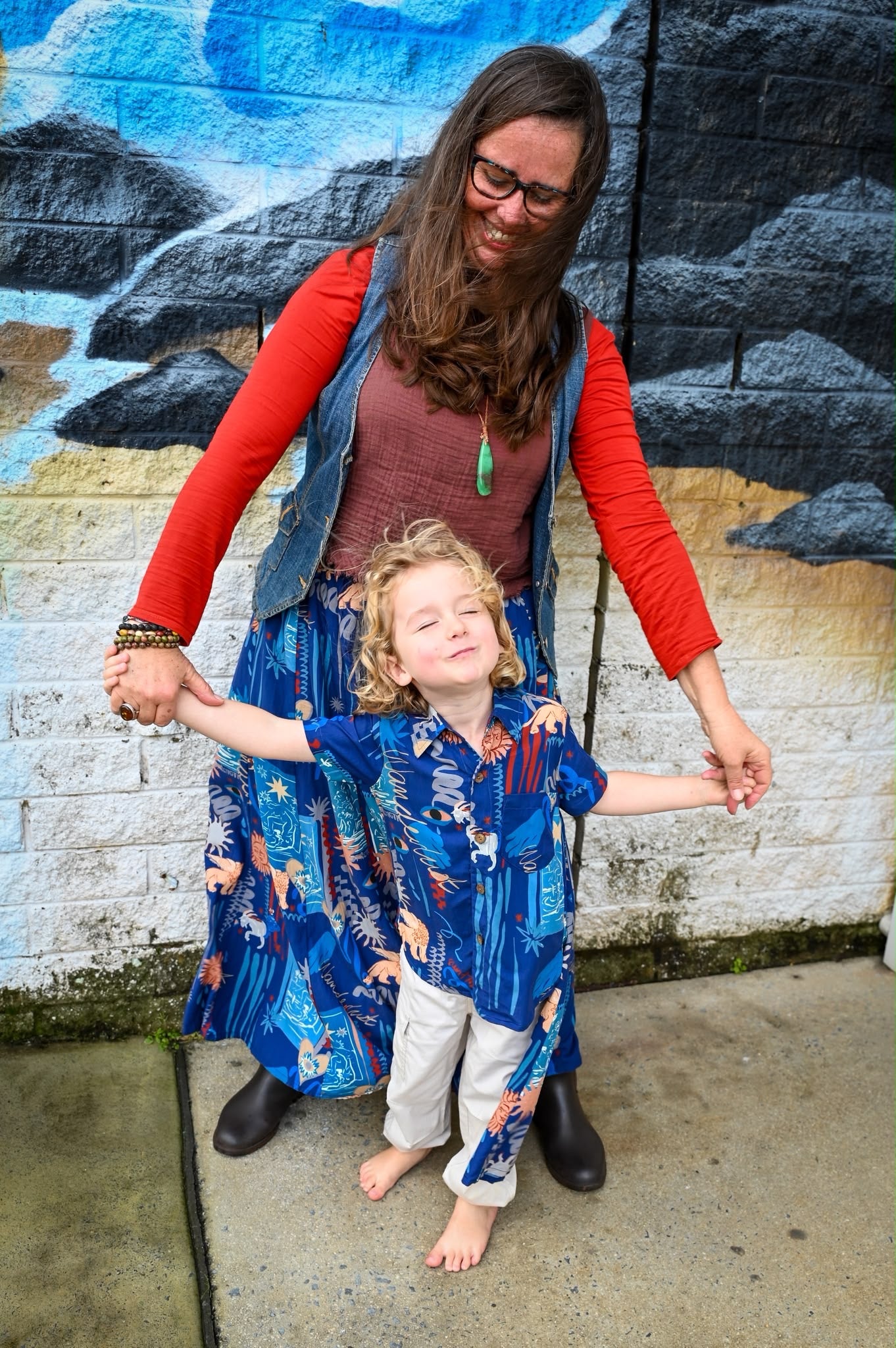 A woman and a young boy holding hands, wearing Byron Pant and Shirt in Wanderlust Navy.