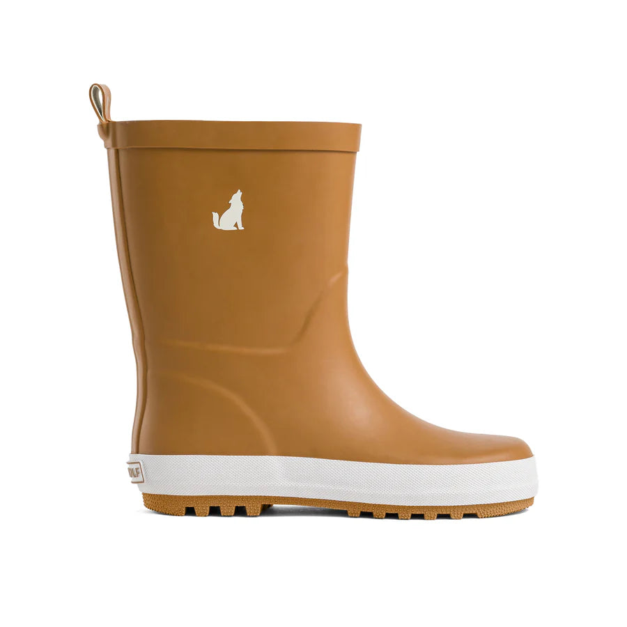 A single tan rubber rain boot with a white sole and a small white Crywolf logo on the side, shown from the side against a plain white background.
