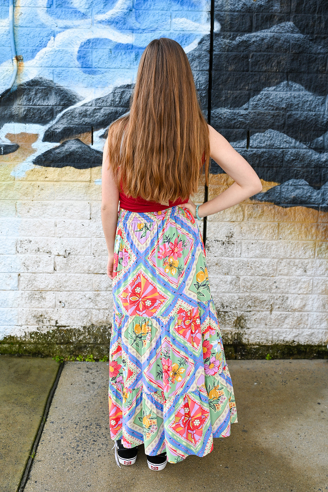 A young woman with long brown hair waearing aeve Maxi Skirt Butterfly Patch Print.