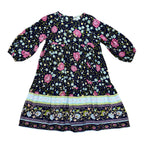 A long-sleeve MilaMeli Lotte Dress Indigo Wildflower Print in a white background.