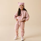 Child wearing a Wilson & Frenchy Rose Organic Quilted Jacket.